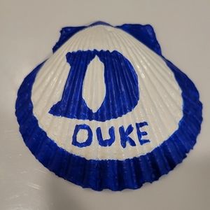 Handpainted Seashell Duke logo.